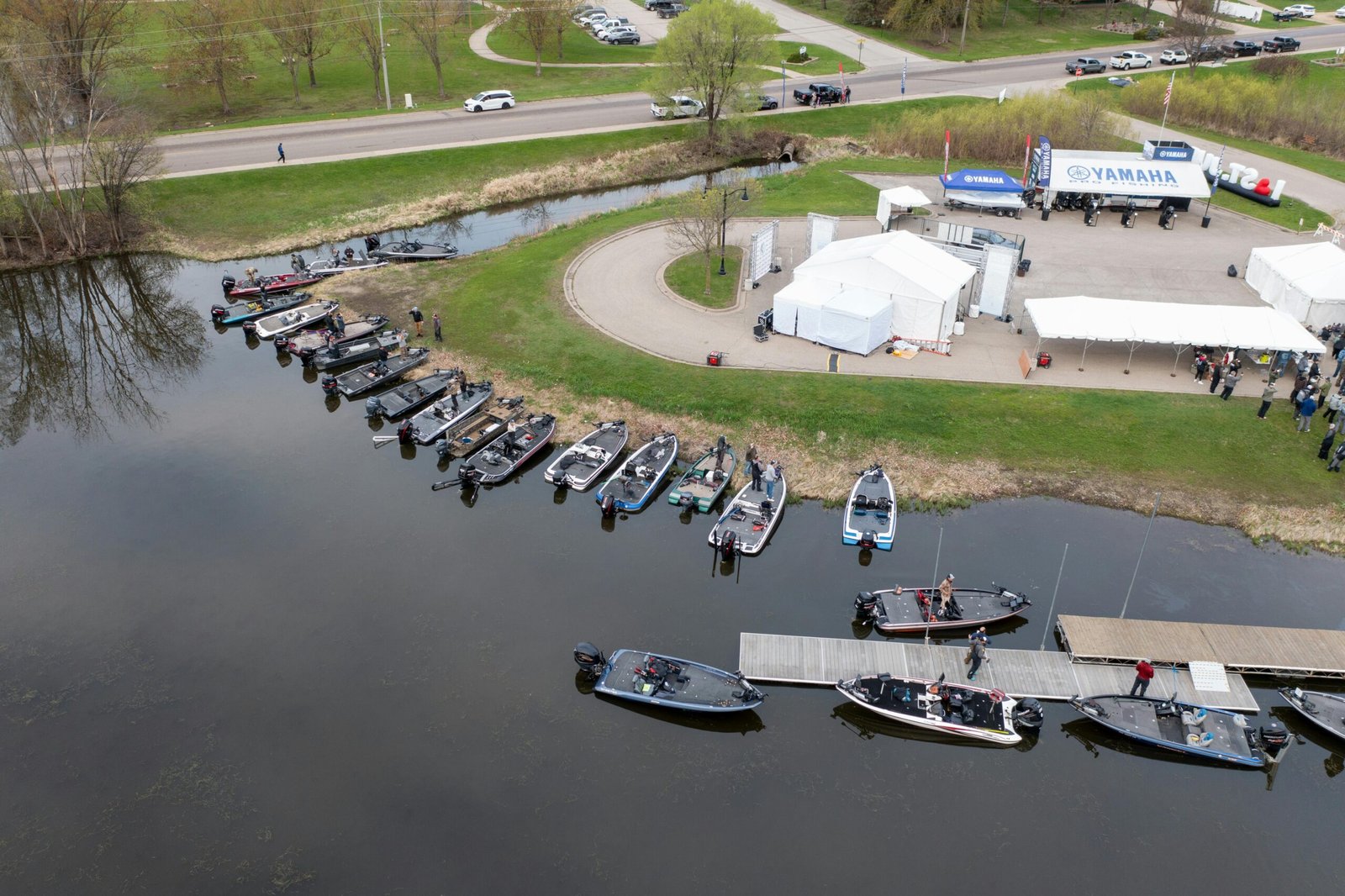 pexels-photo-32417778-32417778 Aerial view of a boat gathering and tents near the shoreline in Wabasha, Minnesota.